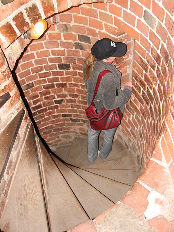 Ieva descending a very steep and narrow staircase