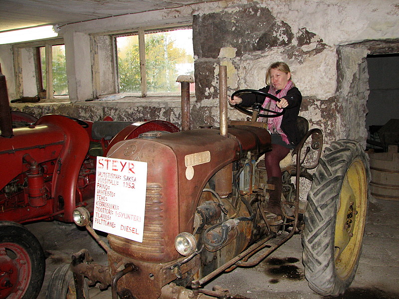Hanna driving a tractor